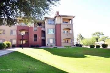 Phoenix house for rent - an apartment building with a lawn in front of it