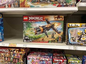 Cartersville house for rent - A shelf of toys including Lego and Vidiyo.