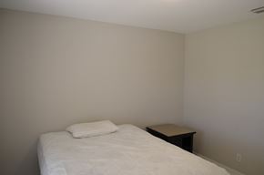 Cape Coral house for rent - a small bedroom with a bed and a small table