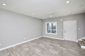 Waukee apartment for rent - A room with a fan and a door.