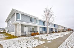 Waukee apartment for rent - A row of houses with snow on the ground.