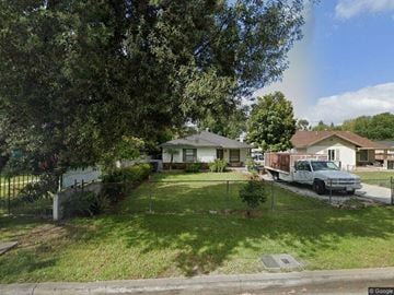 West Covina house for rent - a truck parked in a yard in front of a house