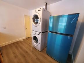 Belleville apartment for rent - a washing machine next to a refrigerator in a room
