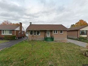 Belleville apartment for rent - a brick house with a yard and a street