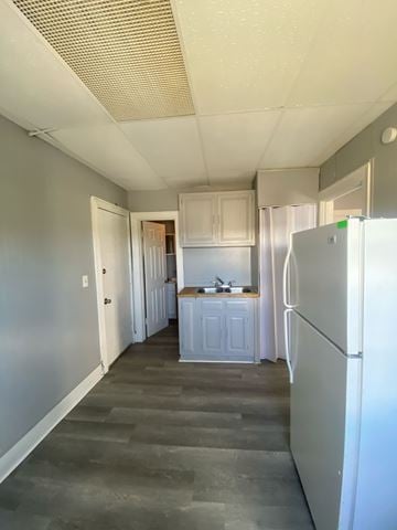 Cincinnati apartment for rent - A kitchen with a refrigerator on the right side.