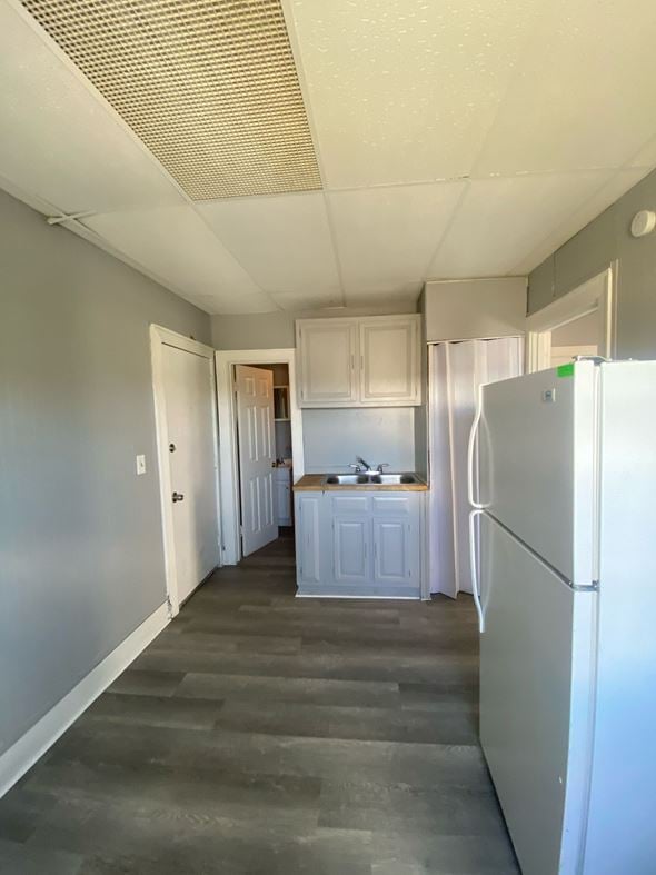 Cincinnati apartment for rent - A kitchen with a refrigerator on the right side.