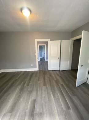 Cincinnati apartment for rent - A room with a light on and a doorway leading to another room.
