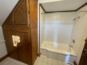 Pine Island house for rent - a bathroom with a bath tub and a closet