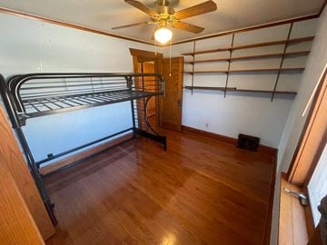 Pine Island house for rent - a bedroom with a bunk bed and a ceiling fan
