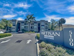 Tampa apartment for rent - The Artisan building is a modern apartment complex with a clear blue sky in the background.