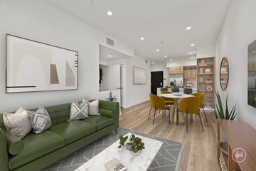Los Angeles apartment for rent - A living room with a green couch and a coffee table.
