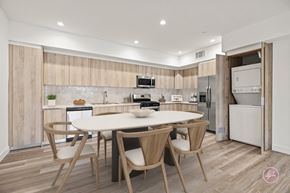 Los Angeles apartment for rent - a kitchen with a white table and chairs and a white refrigerator and stove