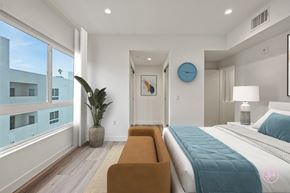 Los Angeles apartment for rent - a bedroom with a large bed and a large window