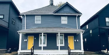 Indianapolis apartment for rent - a blue house with two yellow doors