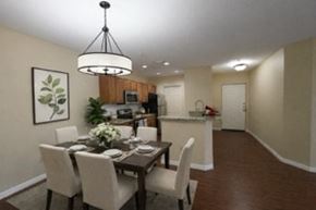 Tampa apartment for rent - A dining room with a table set for six people.