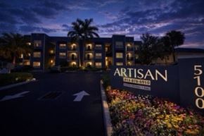 Tampa apartment for rent - The Artisan hotel sign is lit up at night.