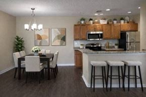 Tampa apartment for rent - A kitchen with a dining table and chairs.