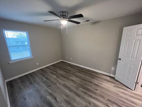 Decatur apartment for rent - A room with a ceiling fan and a window.