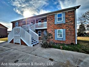 Decatur apartment for rent - A brick house with a white staircase in front.