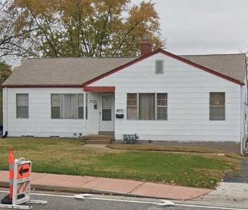 Saint Ann apartment for rent - a white house on the side of a street