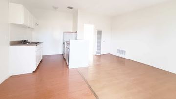 Anaheim apartment for rent - A kitchen area with a refrigerator, oven, and sink.