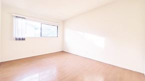 Anaheim apartment for rent - A room with a window and wooden floor.