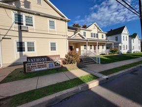 Bloomsburg apartment for rent - a house with a sign in front of it on a sidewalk