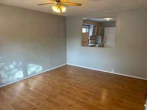 Prince Albert house for rent - A room with wooden floors and a ceiling fan.