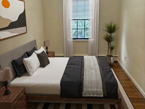 Swarthmore apartment for rent - A bedroom with a large bed and a painting on the wall.