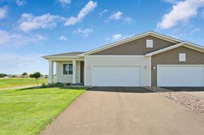 New Richmond house for rent - a house with a white garage door and a driveway