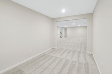 New Richmond house for rent - the living room and dining room in a new home with white walls and carpet