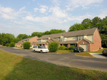 Knoxville apartment for rent - a neighborhood of houses with cars parked on the street
