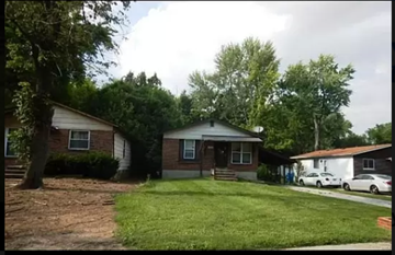 Ferguson house for rent - a house with a yard and cars parked in front of it