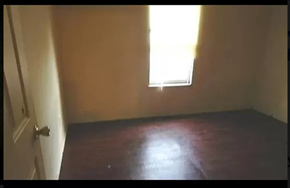 Ferguson house for rent - an empty room with a window and a wooden floor