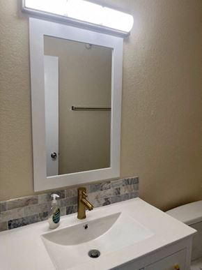 Hawthorne apartment for rent - a bathroom with a white sink and a mirror