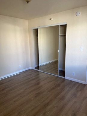 Hawthorne apartment for rent - an empty living room with a hard wood floor
