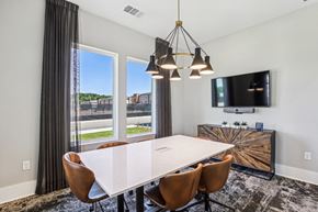 Atlanta apartment for rent - A modern dining room with a large table and chairs.