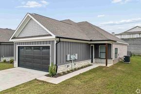 Columbus apartment for rent - A modern house with a grey garage door and a brown roof.