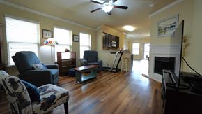 Heartland house for rent - a living room with furniture and a fireplace