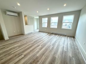 Kentville apartment for rent - an empty living room with hardwood floors and a large window