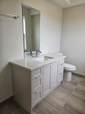 Kentville apartment for rent - a bathroom with a sink and a toilet and a mirror