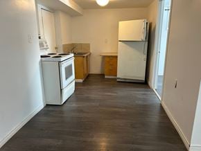 Prince Albert house for rent - a kitchen with a stove and a refrigerator in it