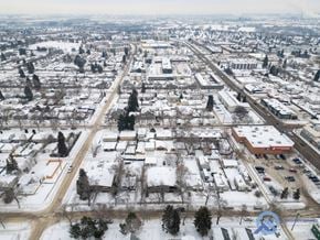 Edmonton apartment for rent - A winter scene of a city with snow-covered ground and buildings.