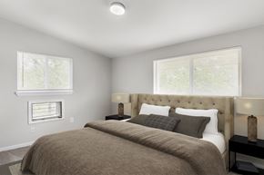 District Heights apartment for rent - a bedroom with a bed and two windows