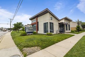Essex apartment for rent - A building with a sign that says "River Crossing" in front of it.