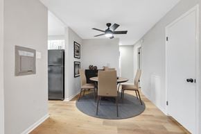 Capitol Heights apartment for rent - a dining room with a table and chairs and a ceiling fan