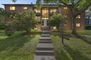Capitol Heights apartment for rent - A brick building with a tree in front of it.