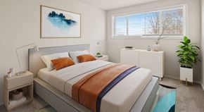Suitland apartment for rent - A bedroom with a large bed and a painting on the wall.