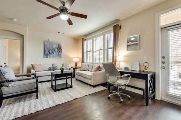 Dallas house for rent - a living room with furniture and a ceiling fan