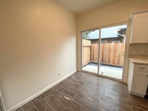 Merced house for rent - a living room with a sliding glass door to a patio